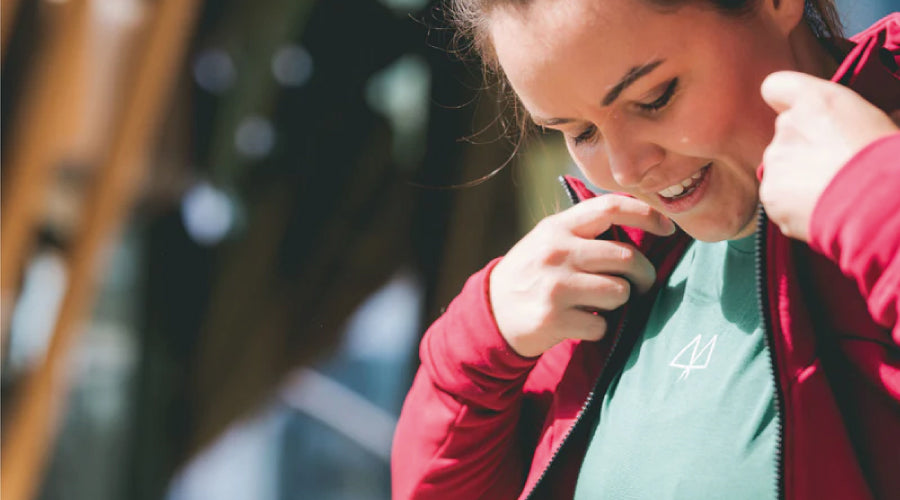 Mari founder of MAAREE wearing a Sisterhoodie standing outdoors