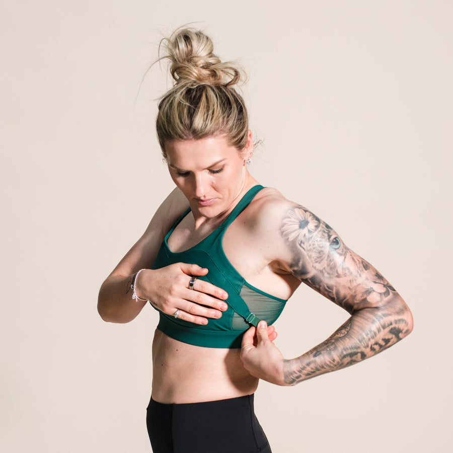 Millie_bright_adjusting_green_maaree_sports_bra_from_side